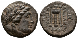 (2.92g 16mm Bronze)SELEUCID KINGDOM. Antiochus II Theos (261-246 BC). AE Sardes.
 Laureate head of Apollo right 
Rev: tripod, monograms to outer left ...