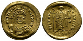 (Gold,4.46g 22mm) JUSTINIAN I (527-565). GOLD Solidus. Constantinople.
Helmeted and cuirassed bust facing, holding globus cruciger and shield decorate...