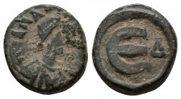 (Bronze, 2.43g 14mm) Anastasius I (491-518). AE 5 Nummi Constantinople, 517-8. 
Diademed and draped bust right. 
Rev.Large E; two pellets and Δ.
 MIBE...
