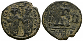 (Bronze, 10.48g 28mm) Phocas (602-610). AE 40 Nummi Theoupolis (Antioch), year 5 (606/7). 
Phocas and Leontia standing facing; the emperor, wearing cr...