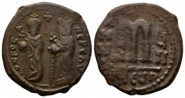 (Bronze, 9.61g 26mm) Phocas. 602-610. AE follis Antioch mint 
Phocas on left and Leontia on right, standing facing; he holds a globus cruciger while s...
