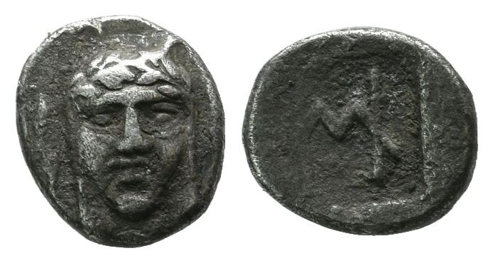 Ionia, Kolophon. ca.450-410 BC. AR Hemiobol (7mm, 0.45g). Facing laureate head o...