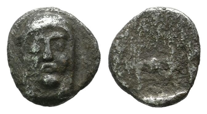 Ionia, Kolophon. ca.450-410 BC. AR Hemiobol (8mm, 0.43g). Facing laureate head o...