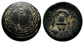 Kings of Macedon. Philip III Arrhidaios, 323-317 BC. Æ (15mm, 4.59g). Sardes mint. Macedonian shield, kerykeion (caduceus) on boss. / Macedonian helme...