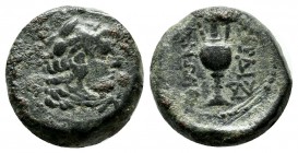 Lydia, Sardes. 133 BC-14 AD. Æ (15mm, 4.81g). Head of youthful Herakles right, wearing lion's skin headdress. / ΣΑΡΔΙ / ΑΝΩΝ. Kantharos; Θ to left, in...