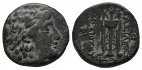 Seleukid Kingdom. Antiochos II Theos, 261-246 BC. Æ (16mm, 4.44g). Sardes mint. Laureate head of Apollo right. / BAΣΙΛΕΩΣ ANTIOXOY. Tripod; anchor bel...