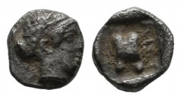 Troas, Antandros. Late 5th century BC. AR Tetartemorion (6mm, 0.28g). Head of Artemis Astyrene right, hair bound with fillet. / ANT. Astragalos within...