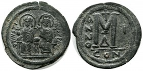Justin II with Sophia, AD 565-578. Æ Follis (32mm, 15.73g). Constantinople mint, 1st officina. Dated RY 1 (565/6). Justin, holding globus cruciger, an...