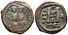Justin II with Sophia, AD.565-578. Æ Follis - 40 Nummi (30mm, 13.47g). Nicomedia mint, 2nd officina. Dated RY 10. D N IVSTI-NVS P P AVC. Justin, holdi...
