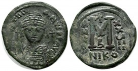 Justinian I. AD.527-565. Æ Follis (31mm, 16.46g). Nicomedia. Dated RY 29 (555/6). D N IVSTINIANVS P P AVG. Helmeted and cuirassed bust facing, holding...