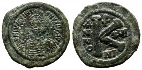 Justinian I. AD.527-565. Æ Half Follis (27mm, 9.98g). Nicomedia mint. Dated RY 16 (542/3). Helmeted and cuirassed bust facing, holding globus cruciger...