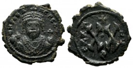 Phocas, AD.602-610. Æ Half Follis (21mm, 4.85g). Antiochia mint. dN FOCA NE PE AV. Crowned and mantled bust facing, holding mappa and eagle-tipped sce...