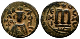 Umayyads. Undated, ca.661-697 AD. Æ Fals (20mm, 4.69g). Hims (Emesa) mint. Type VII. Facing bust of Byzantine emperor, holding globus cruciger; KAΛON ...