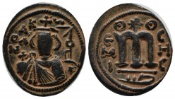 Umayyads. Undated, ca.661-697 AD. Æ Fals (21mm, 4.33g). Hims (Emesa) mint. Type VII. Facing bust of Byzantine emperor, holding globus cruciger; KAΛON ...