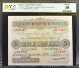 CEYLON. Government of Ceylon. 5 Rupees, 1928. P-22. PCGS Banknote Very Fine 30.

Printed by TDLR. Elephant and palm trees on back. Lovely green and ...