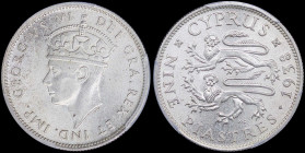 CYPRUS: 9 Piastres (1938) in silver (0,925) with crowned head of King George VI facing left. Two stylized rampant lions and date on reverse. Inside sl...