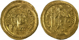BYZANTINE EMPIRE: Justinian I, 527-565, AV solidus (4.45g), Constantinople, S-140, helmeted and cuirassed bust, holding globus cruciger & shield // an...