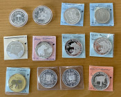 WORLDWIDE: LOT of 12 coins, ASW 8.0604, including Leopard and Elephant coins: Mongolia (1 pc), Ivory Coast (1), Equatorial Guinea (1), Uganda (1), Coo...