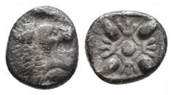 Ionia, Miletos. 520-470 BC. AR Diobol, 1.0gr, 8.1mm.. Forepart of lion right, head turned back / Star-like floral pattern.