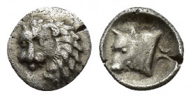 CARIA. Uncertain. Obol (Circa 400-340 BC). 0.2g 8mm Obv: Head of lion left. Rev: Head of bull left; symbol behind.