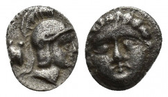 Pisidia, Selge, Obol, 0.8gr, 8.9mm. 350-300 BC Obverse: facing gorgoneion Reverse: head of Athena in corynthian helmet right astragalos to left