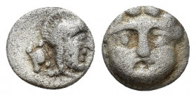 Pisidia, Selge, Obol, 0.9gr, 9.1mm. 350-300 BC Obverse: facing gorgoneion Reverse: head of Athena in corynthian helmet right astragalos to left