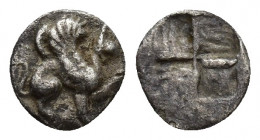 Ionia, Teos AR Obol. Circa 500-460 BC. 0.2gr. 7.6mm. Griffin seated right. Rev: Quadripartite incuse square.