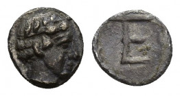 Ionia - Kolophon - Autonomous Tetartemorion 490-400 BC. 0.2g 6.5mm Obv: head of Apollo right. Rev: TE monogram in incuse square.