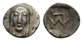 Ionia, Kolophon AR Hemiobol. Circa 450-410 BC. Facing head of Apollo / Monogram within incuse rectangle. 0.3g, 8mm