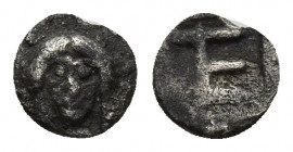 IONIA, Kolophon. Circa 500-450 BC. AR Tetartemorion (6.3mm, 0.2g). Facing head of Apollo / TE monogram within incuse rectangle.