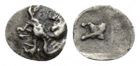 TROAS. Assos. Teteartemorion (Circa 480-450 BC). 0.3g 7.8mm Obv: Griffin crouching right. Rev: Astragalos within incuse square.