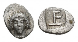 Ionia. Kolophon circa 450-410 BC. Tetartemorion AR 6.22 mm, 0,2 g Facing head of Apollo with long hair / TE monogram within incuse square.