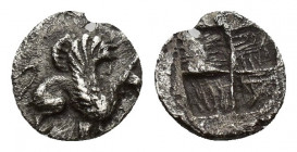 IONIA, Teos. Circa 450-425 BC. AR Tritemorion or Tetarteemorion(?) (7.2mm, 0.2 g). Griffin seated right, raising forepaw / Quadripartite incuse square...