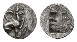 IONIA, Teos. Circa 450-425 BC. AR Tritemorion or Tetarteemorion(?) (8mm, 0.1 g). Griffin seated right, raising forepaw; ivy leaf to right / Quadripart...