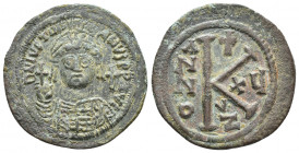 Justinian I. 527-565. Æ Half Follis (30.7mm, 11.1 g. Cyzicus mint. Dated RY 15 (541/2). Helmeted and cuirassed bust facing, holding globus cruciger an...