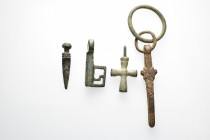 Antiquites Roman and Byzantine mixed lot 4 pieces.Lot includes a Roman amulet pendant a roman bronze key a wearable byzantine cross and a cosmetic twe...