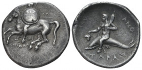 Calabria, Tarentum Nomos circa 280-272, AR 22.00 mm., 6.43 g.
 Warrior, holding shield decorated with stellate pattern and two spears, on horse pranc...