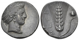 Lucania, Metapontum Nomos circa 400-340, AR 21.00 mm., 7.71 g.
Head of Demeter r., hair bound in fillet which circles. Rev. Barley ear of seven grain...