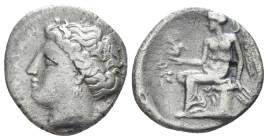 Bruttium, Terina Drachm circa 300, AR 15.00 mm., 1.86 g.
Head of the nymph Terina l.; triskeles behind neck. Rev. Nike seated l. on plinth, holding o...