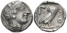Attica, Athens Tetradrachm after 449, AR 25.50 mm., 17.10 g.
Head of Athena r., wearing crested Attic helmet decorated with three olive leaves and a ...