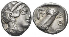 Attica, Athens Tetradrachm circa 403-365, AR 25.00 mm., 17.08 g.
Head of Athena r., wearing Attic helmet decorated with olive leaves and palmette. Re...