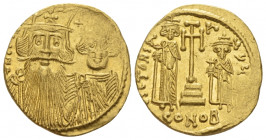 Constans II, 641-668. Solidus Constantinople circa 662-667, AV 20.00 mm., 4.47 g.
Draped facing busts of Constans II, wearing plumed helmet, and Cons...