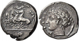 Catana 
Tetradrachm signed by Euainetos circa 410-405, AR 17.17 g. Fast quadriga to l. about to steer around an Ionic column; charioteer wears long c...