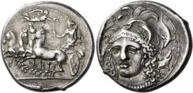 Syracuse 
Tetradrachm signed by Eukleidas circa 413-399, AR 17.31 g. Fast quadriga driven l. by female charioteer, holding reins in l. hand and raisi...
