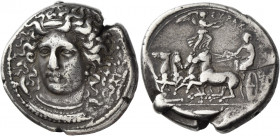 Syracuse 
Tetradrachm signed by Kimon circa 405-400, AR 16.83 g. Head of nymph Arethusa facing three-quarters l., wearing pearl-shaped pendant and ne...