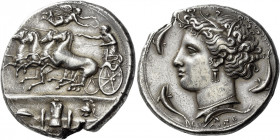 Syracuse 
Decadrachm signed by Euainetos circa 400 BC, AR 43.19 g. Fast quadriga driven l. by charioteer, holding reins and kentron; in field above, ...