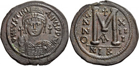 Justinian I, 527 – 565 
Follis, Nicomedia 538-539 (year 13), Æ 22.45 g. D N IVSTINI – ANVS P P AVG Helmeted, pearl-dia­demed and cuirassed bust facin...