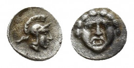Pisidia, Selge, Obol, 0.2gr, 5.7mm. 350-300 BC Obverse: facing gorgoneion Reverse: head of Athena in corynthian helmet right astragalos to left