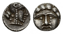 Pisidia, Selge, Obol, 0.5gr, 9.1mm. 350-300 BC Obverse: facing gorgoneion Reverse: head of Athena in corynthian helmet right astragalos to left