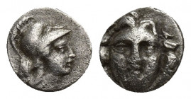 Pisidia, Selge, Obol, 0.8gr, 9.7mm. 350-300 BC Obverse: facing gorgoneion Reverse: head of Athena in corynthian helmet right astragalos to left